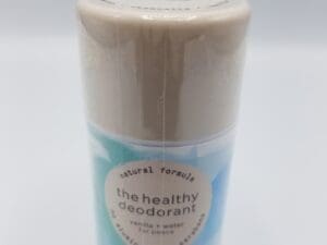 A bottle of deodorant on top of a counter.