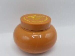 An Ever Sheen Cocoa Butter Crème 250ml (Lot of 2) jar with a lid on it.