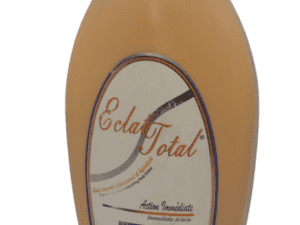 A single bottle of Eclat Total Immediate Action Lightening Body Lotion 2in1 - 500ml with a beige and white label on a transparent background.