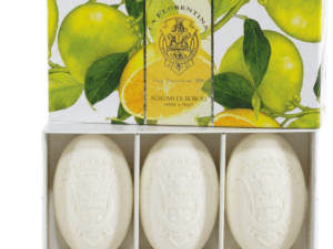 Three bars of soap in a box with lemons on them.