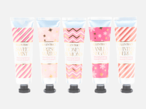A set of five different hand creams in pink and white.