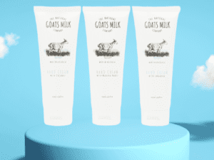 Three tubes of lotion sitting on top of a blue pedestal.