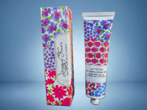 A tube of hand cream with flowers on it
