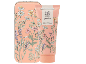 A pink tin with a tube of hand cream on top